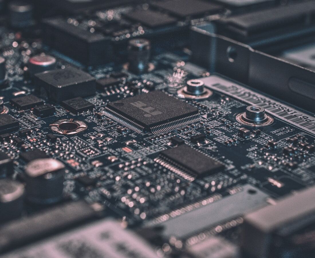 A circuit board photographed close, its traces and components in sharp relief.